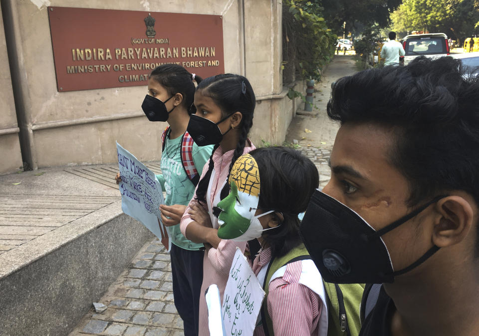 Schoolchildren protest outside the Indian Environment Ministry against alarming levels of pollution in the city, in New Delhi, India, Tuesday, Nov. 5, 2019. Air pollution in New Delhi and northern Indian states peaks in the winter as farmers in neighboring agricultural regions set fire to clear land after the harvest and prepare for the next crop season. The pollution in the Indian capital also peaks after Diwali celebrations, the Hindu festival of light, when people set off fireworks. (AP Photo/Shonal Ganguly)