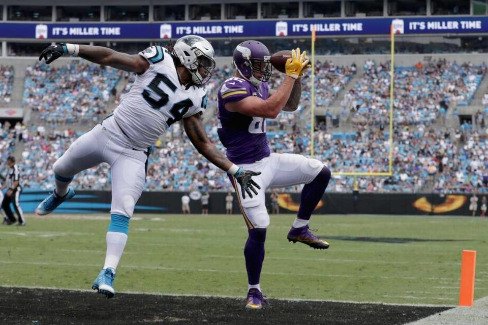 Kyle Rudolph #82 of the Minnesota Vikings catches a touchdown pass against Shaq Green-Thompson #54 of the Carolina Panthers in the 3rd quarter during their game at Bank of America Stadium on September 25, 2016 in Charlotte, North Carolina. (Photo by Streeter Lecka/Getty Images)