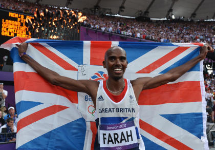 Mohamed Farah holds a union jack as he celebrates winning gold in the Men's 5000m Final (Getty Images)