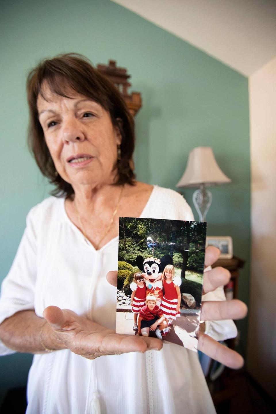 Denise Smart holds a favorite photo of her children, Kristin, Lindsey and Matt, on May 24, 2023, at her home in Stockton.