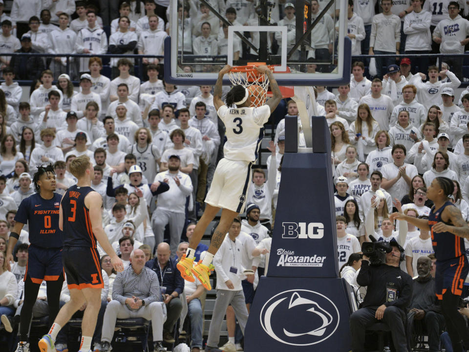 Penn State's Nick Kern Jr. (3) dunks against Illinois during the first half of an NCAA college basketball game Wednesday, Feb. 21, 2024, in State College, Pa. (AP Photo/Gary M. Baranec)