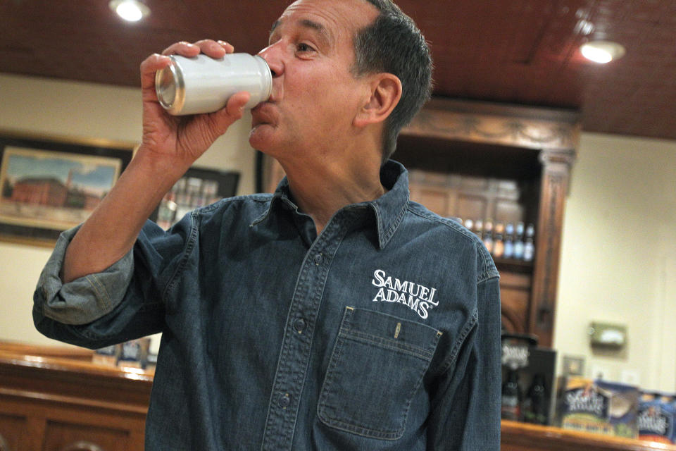 BOSTON - FEBRUARY 14: Jim Koch, brewer/founder of Sam Adams.  He drinks from the newly developed can.  At the Sam Adams Brewery, Roy Desrochers, sensory practice leader with GEI Consultants, Inc., and Koch discuss the development of a can for the beer, on Thursday, Feb. 14, 2013. (Photo by Pat Greenhouse/The Boston Globe via Getty Images)