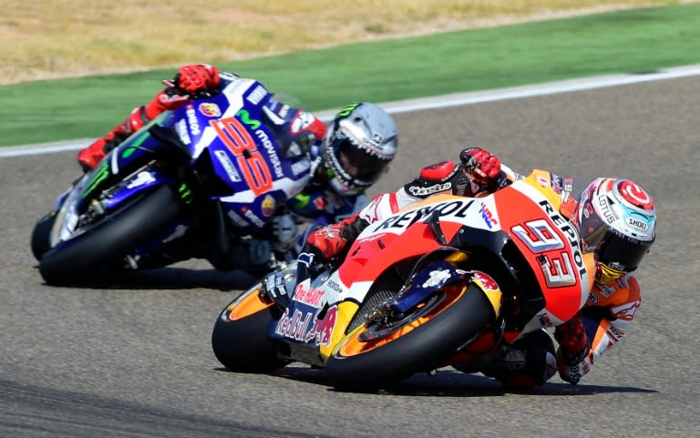 Spanish rider Marc Marquez (R) and compatriot Jorge Lorenzo compete in the Aragon MotoGP in Alcaniz on September 25, 2016