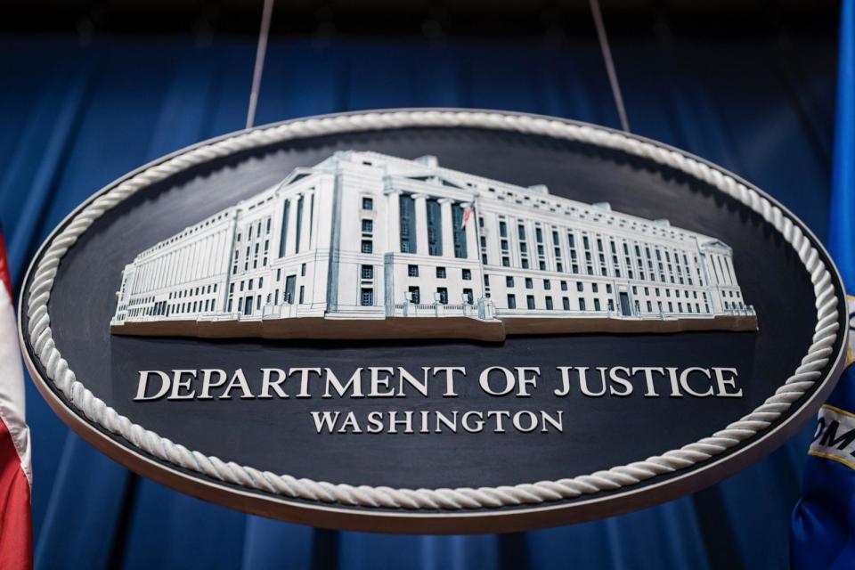 PHOTO: Seal of the Department of Justice before a news conference in Washington, D.C., Jan. 24, 2023. (Al Drago/Bloomberg via Getty Images)