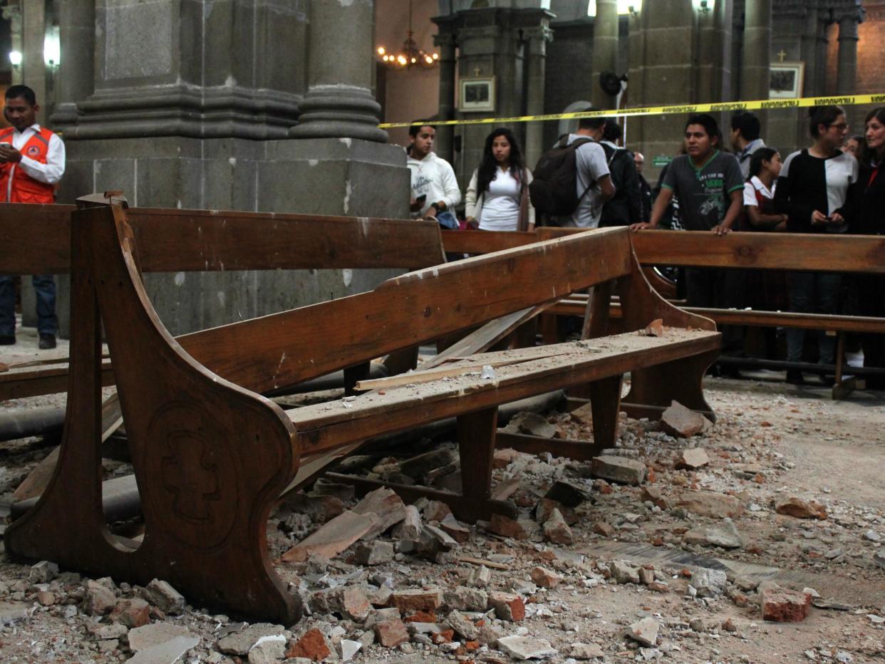 View of damage caused inside a church by a 6.9 magnitude earthquake in Quetzaltenango, 220 km from Guatemala City, on 14 June 2017: MISAEL LOPEZ/AFP/Getty Images