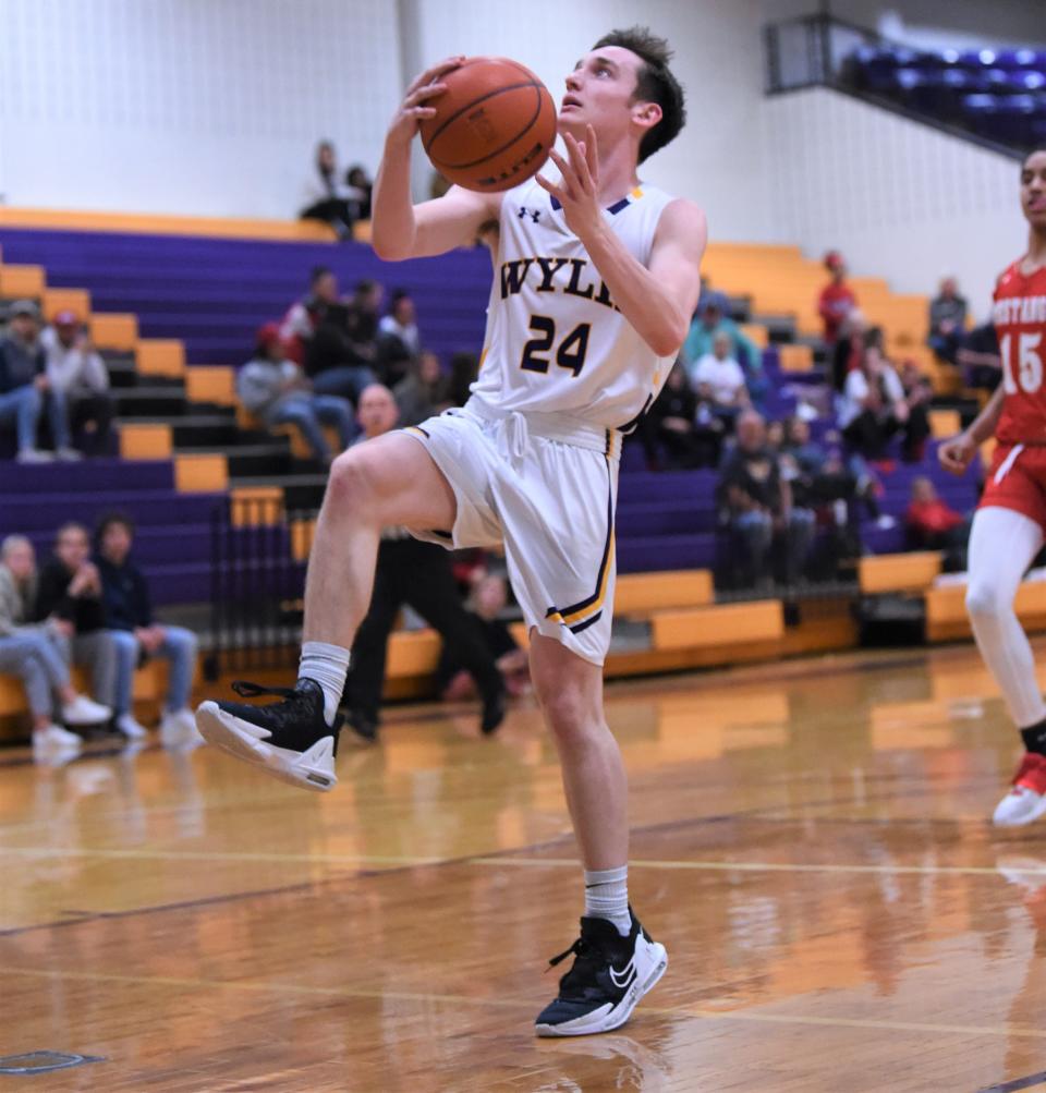 Wylie's Martin Marshall (24) goes up for a layup late in Friday's game against Lubbock Coronado.