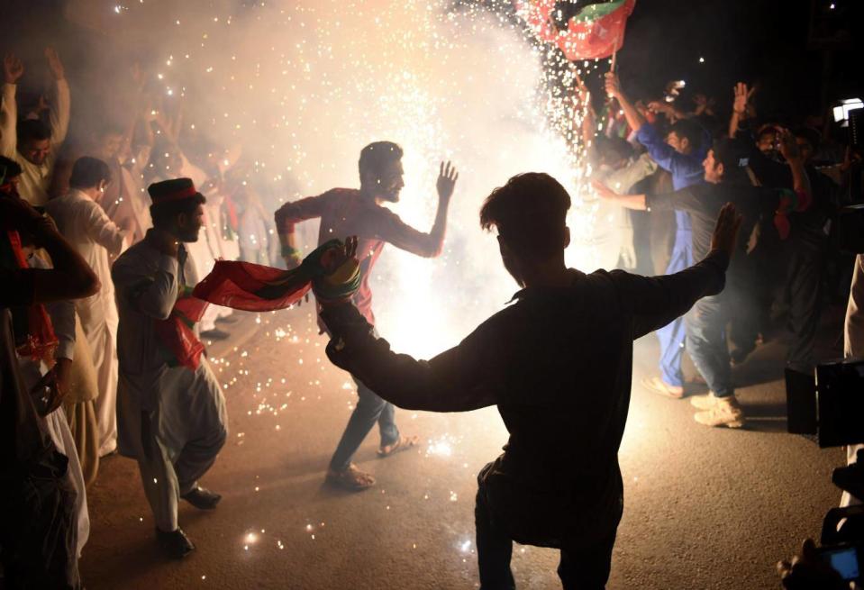 Supporters of Pakistan’s cricketer-turned-politician celebrate his election in July (AFP/Getty)