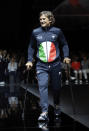In this photo taken on Saturday, June 15, 2019 file photo, Alex Zanardi takes the catwalk during the Emporio Armani men's Spring-Summer 2020 collection, unveiled during the fashion week, in Milan, Italy. Race car driver turned Paralympic champion Alex Zanardi has been seriously injured again. Police tell The Associated Press that Zanardi was transported by helicopter to a hospital in Siena following a road accident near the Tuscan town of Pienza during a national race for Paralympic athletes on handbikes. The 53-year-old Zanardi had both of his legs amputated following a horrific crash during a 2001 CART race in Germany. He was a two-time CART champion. (AP Photo/Luca Bruno, File)