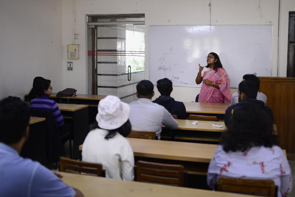 Shahrima Tanjin Arni, 26, who teaches law at Dhaka University, takes a lecture with her students in Dhaka, Bangladesh, Dec. 12, 2023. “I feel that Sheikh Hasina is that leader in Bangladesh who is a perfect combination of both generations,” Arni said. “She holds the values of the past, but at the same time, she has a progressive thinking in her progressive heart, which is not very common in Bangladeshi societies.” Arni credits Hasina for being a “ bold leader” with a vision for a digital future. (AP Photo/Mahmud Hossain Opu)