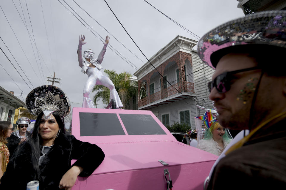 People walk in costumes during the Society of Saint Anne parade through Bywater and Marigny neighborhoods on Mardi Gras Day in New Orleans, Tuesday, Feb. 13, 2024. (AP Photo/Matthew Hinton)