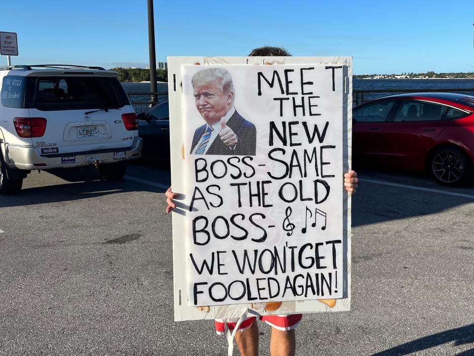 Pro-Trump sign held outside Mar-a-Lago.