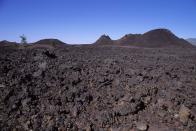 <p><strong>Craters of the Moon National Monument & Preserve</strong></p><p><a href="https://www.nps.gov/crmo/index.htm" rel="nofollow noopener" target="_blank" data-ylk="slk:Craters of the Moon National Monument & Preserve;elm:context_link;itc:0;sec:content-canvas" class="link ">Craters of the Moon National Monument & Preserve</a> in Snake River Plain in central Idaho. It’s unlike any National Park encompassing three major lava fields. Get your moon shoes because you can see some of the best examples of rift cracks in the world—including the deepest known on earth at 800 feet.</p>