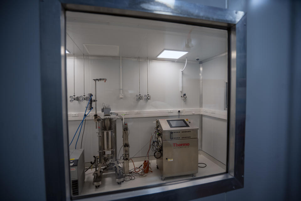 Equipment waiting to be assembled and calibrated sits at an Afrigen Biologics and Vaccines lab facility in Cape Town, South Africa, Tuesday, Oct. 19, 2021. In a pair of warehouses converted into airlocked sterile rooms, Afrigen scientists are assembling and calibrating the equipment needed to reverse engineer Moderna’s coronavirus vaccine. ​(AP Photo/Jerome Delay)