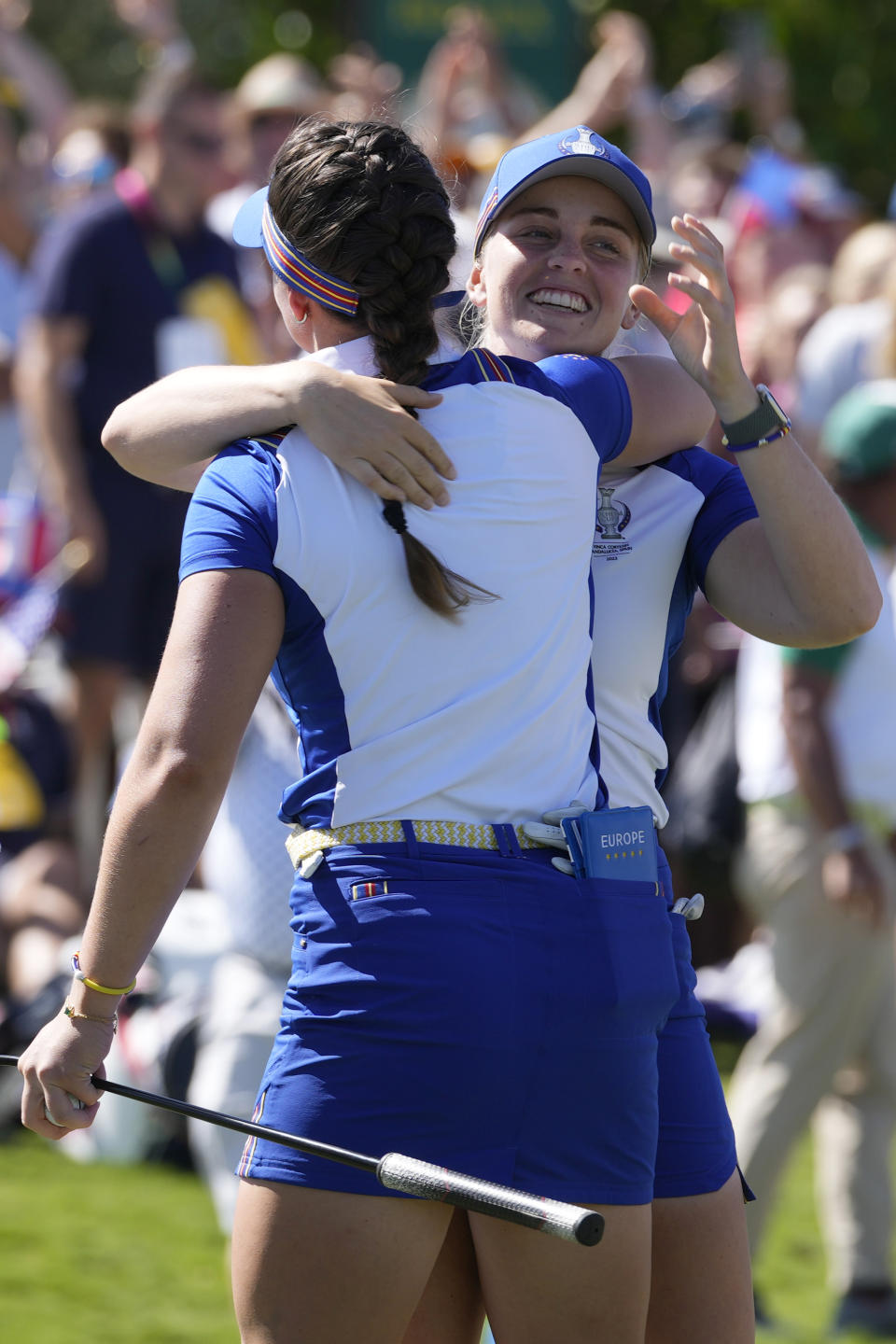 Europe's Maja Stark , right, hugs playing partner Europe's Linn Grant after defeating United States' United States' Danielle Kang and United States' Andrea Lee in their foursome match, on the 18th green at the Solheim Cup golf tournament in Finca Cortesin, near Casares, southern Spain, Saturday, Sept. 23, 2023. Europe play the United States in this biannual women's golf tournament, which played alternately in Europe and the United States. (AP Photo/Bernat Armangue)