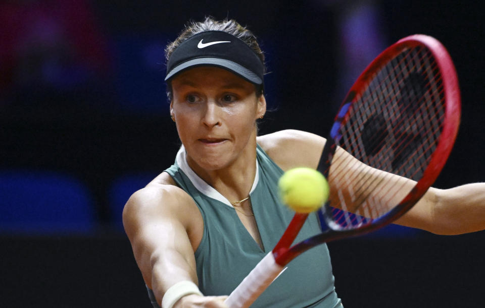 Germany's Tatjana Maria plays a return to Belgium's Elise Mertens during the WTA Tour tennis match in Stuttgart, Germany, Tuesday April 16, 2024. (Marijan Murat/dpa via AP)