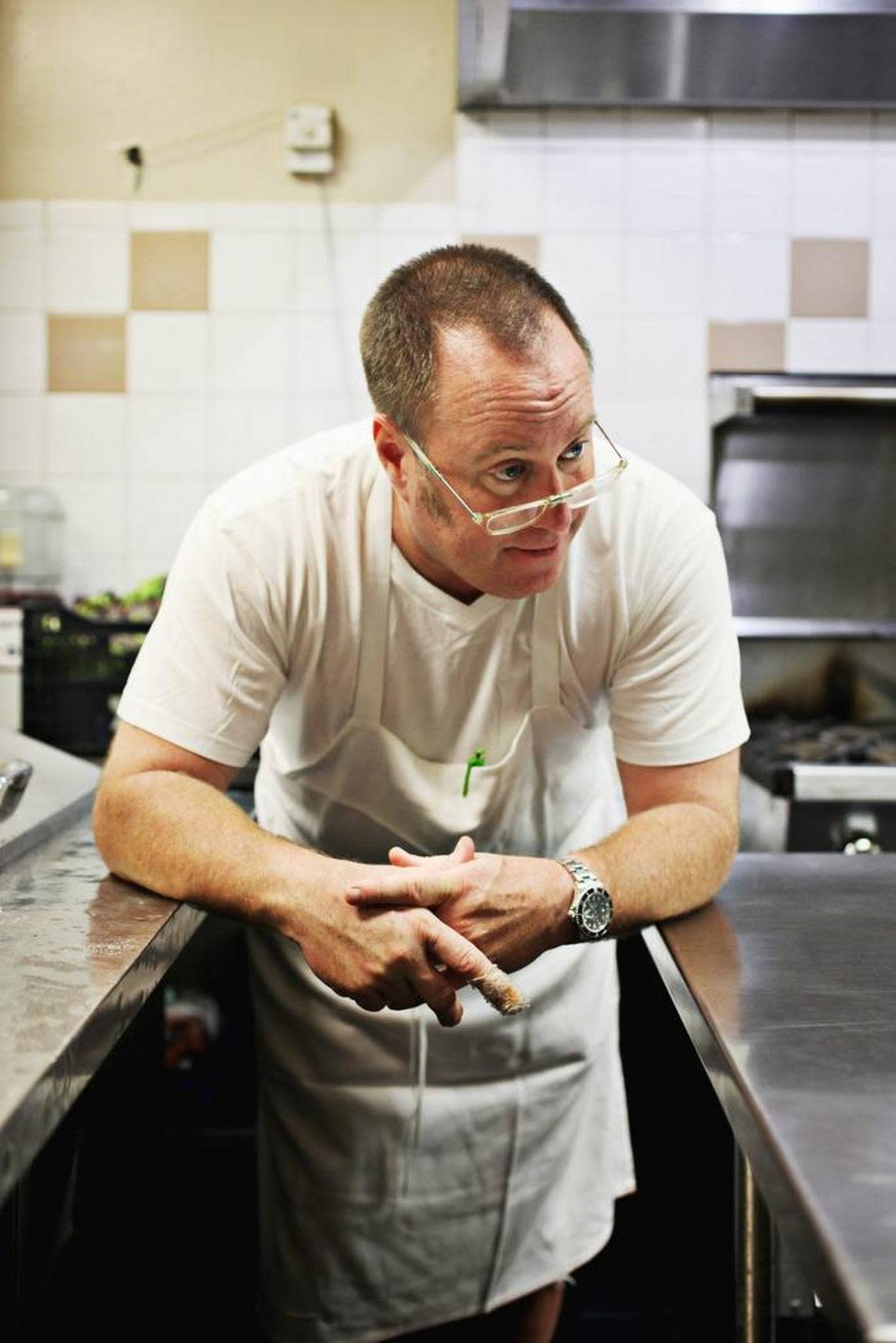 Chef Scott Howell watches a new chef gets to work on his first day at Nana’s on July 6, 2016.