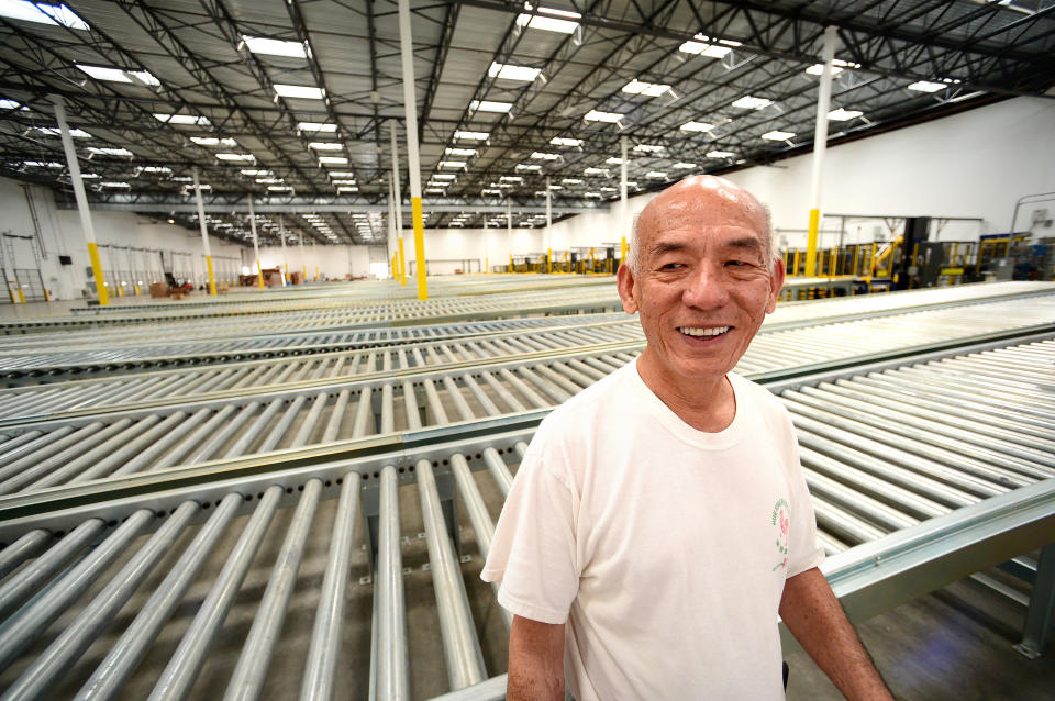 In this July 18, 2013 photo, David Tran, owner of Huy Fong Foods, maker of Sriracha hot sauce, shows his new $15 million, 650,000 square foot factory in Irwindale, Calif. The city of Irwindale on Monday, Oct. 28, 2013 filed a lawsuit in Los Angeles Superior Court asking a judge to stop production at the Huy Fong Foods factory, claiming the chili odor emanating from the plant is a public nuisance. (AP Photo/San Gabriel Valley Tribune, Sarah Reingewirtz) MAGS OUT; NO SALES; MANDATORY CREDIT