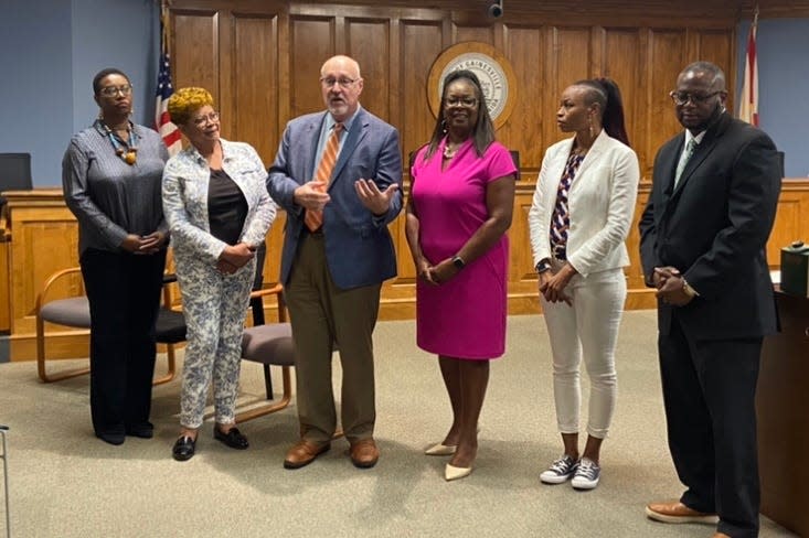 City Manager Cynthia Curry, Commissioner Cynthia Chestnut, Mayor Harvey Ward, Gainesville Housing Authority CEO Pamela Davis, GHA Chairperson Angela Tharpe and GHA COO Malcolm Kiner announce the HUD grant at a press meeting Sept. 15, 2023.