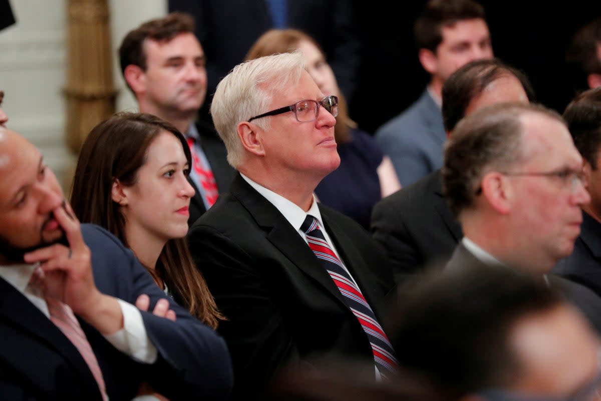 Gateway Pundit publisher Jim Hoft listens as Donald Trump speaks during a ‘social media summit' (REUTERS)