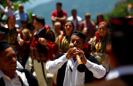 People dressed in folk costumes take part in a traditional wedding ceremony in the village of Galicnik, west of capital Skopje, Macedonia July 15, 2018. REUTERS/Ognen Teofilovski