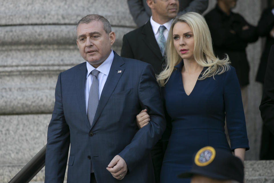 Lev Parnas, left, leaves federal court following his arraignment, Wednesday, Oct. 23, 2019 in New York. (AP Photo/Mark Lennihan)