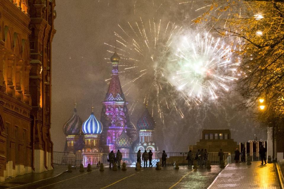 Fireworks explode over the Kremlin in Red Square which was blocked by police during New Year celebrations in Moscow, Russia, Sunday, Jan. 1, 2017. New Year's Eve is Russia's major gift-giving holiday, and big Russian cities were awash in festive lights and decorations. (AP Photo/Alexander Zemlianichenko Jr)