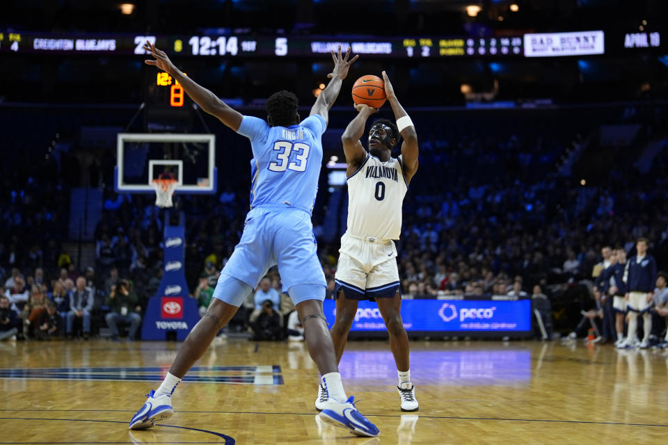Villanova's TJ Bamba, right, goes up for a shot against Creighton's Fredrick King during the first half of an NCAA college basketball game, Saturday, March 9, 2024, in Philadelphia. (AP Photo/Matt Slocum)