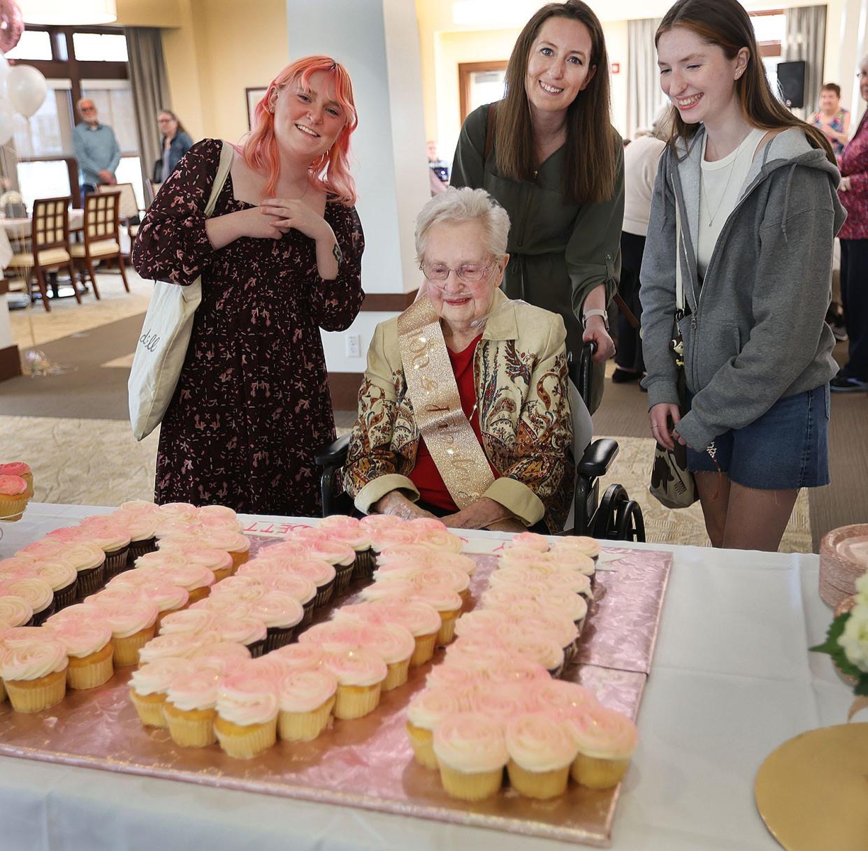 Betty Beecher, with granddaughters Nicole Orsini, Lauryn Beecher and Courtney Orsini, celebrates her 100th birthday at Fairing Way in Weymouth on Monday, April 15, 2024.