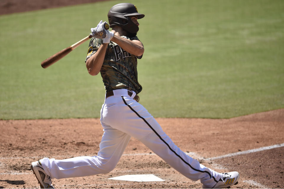 San Diego Padres' Eric Hosmer follows through on a swing for an RBI-double during the fourth inning of a baseball game against the Houston Astros in San Diego, Sunday, Aug. 23, 2020. (AP Photo/Kelvin Kuo)