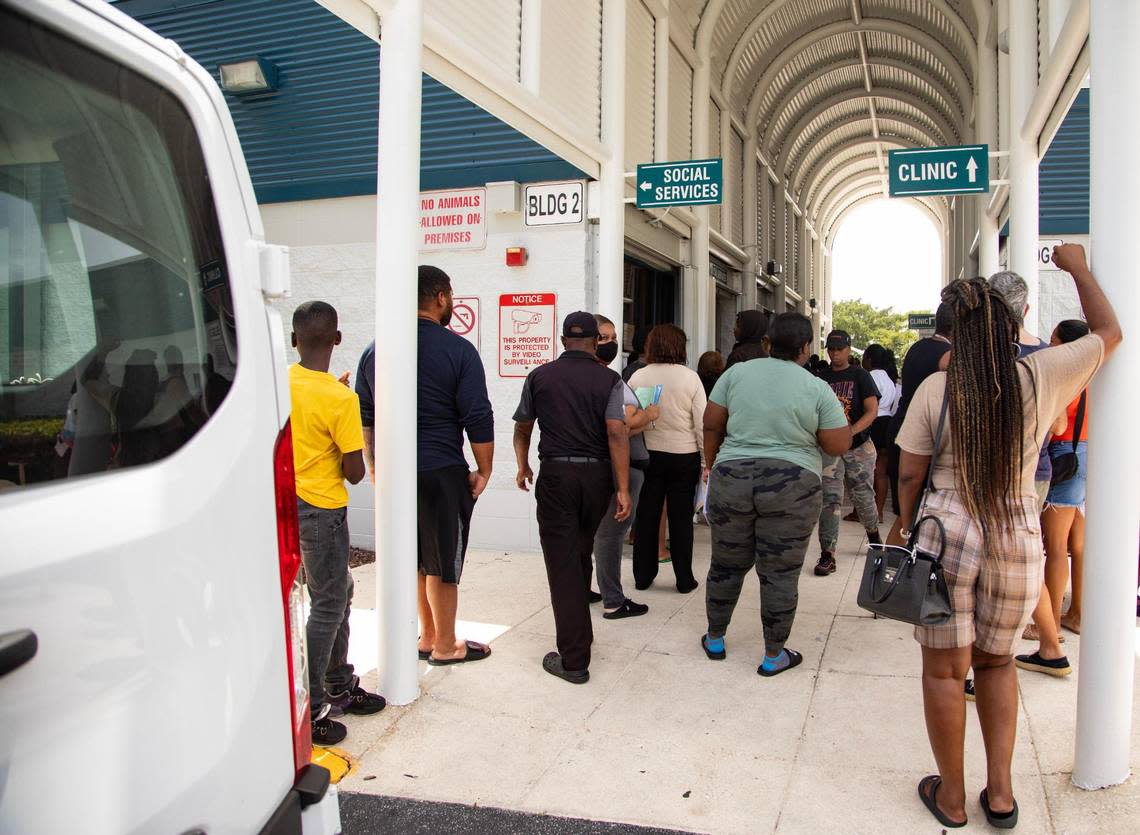 People wait to sign up for LIHEAP, a light bill assistance program, at Annie L. Weaver Health Center in Pompano Beach, Fla., on Thursday, July 20, 2023. Lauren Witte/lwitte@miamiherald.com