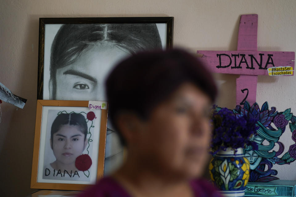 Photographs of Diana Velazquez adorn a small altar in her honor at her home where her mother Lidia Florencio Guerrero gives an interview in Chimalhuacan, State of Mexico, Mexico, Wednesday, May 11, 2022. Velázquez, a 24-year-old candy vendor, was killed in Chimalhuacan, east of Mexico City, in 2017. She left home early one morning to make a phone call. Her body was found later that day dumped in front of a warehouse. She’d been beaten, raped and strangled. (AP Photo/Eduardo Verdugo)