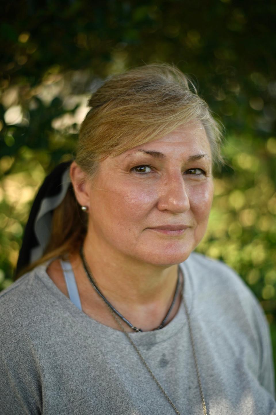 Carolyn Stone in the backyard of her Channelview, Texas, home.