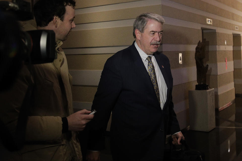 U.S. Undersecretary for Trade and Foreign Agricultural Affairs Ted McKinney is chased by journalists as he walks into a hotel after a second day of meetings with Chinese officials in Beijing, Tuesday, Jan. 8, 2019. An official Chinese newspaper warned Washington not to demand too much from Beijing as talks on ending their tariff war wound up a second day Tuesday with no word on possible progress. (AP Photo/Andy Wong)