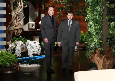 Stephen Schuck and security guard Jesus Campos of the Mandalay Bay Resort and Casino in Las Vegas, pose during the taping of "The Ellen DeGeneres Show" in Burbank, California in this photo released October 18, 2017. Michael Rozman/Warner Bros./Handout via REUTERS