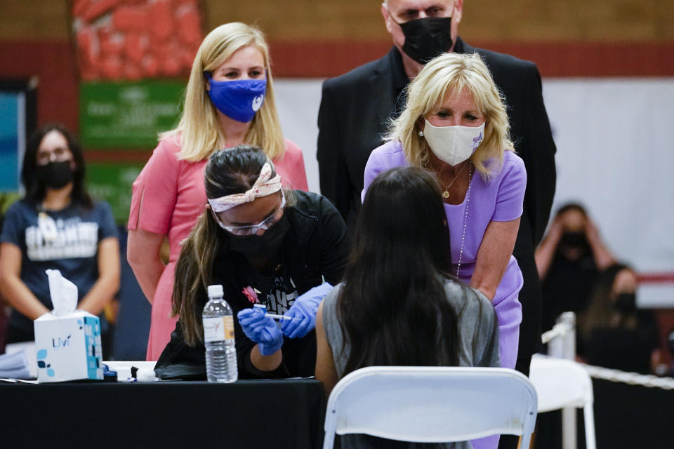 First lady Jill Biden speaks to a COVID-19 vaccination recipient during a tour with Doug Emhoff, husband of Vice President Kamala Harris and Phoenix Mayor Kate Gallego at Isaac Middle School in Phoenix, Wednesday, June 30, 2021. (AP Photo/Carolyn Kaster, Pool)