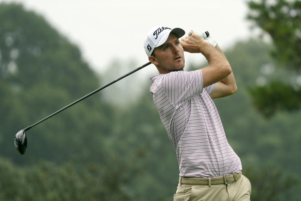 Russell Henley watches his tee shot on the 18th hole during the second round of the Wyndham Championship golf tournament in Greensboro, N.C., Friday, Aug. 4, 2023. (AP Photo/Chuck Burton)