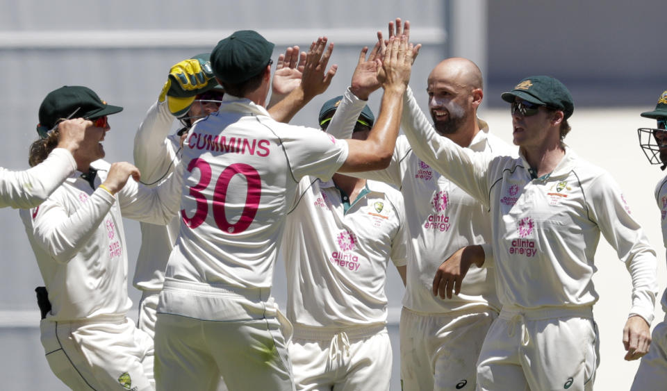 Australian players celebrate the dismissal of India's Rishabh Pant during play on the final day of the third cricket test between India and Australia at the Sydney Cricket Ground, Sydney, Australia, Monday, Jan. 11, 2021. (AP Photo/Rick Rycroft)