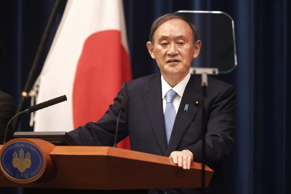 Japan's Prime Minister Yoshihide Suga speaks during a press conference at the prime minister's official residence Friday, May 28, 2021, in Tokyo. Japan extended a coronavirus state of emergency in Tokyo and other areas for 20 more days on Friday, with infections still not slowing as it prepares to host the Olympics in just over 50 days. (Behrouz Mehri/Pool Photo via AP)