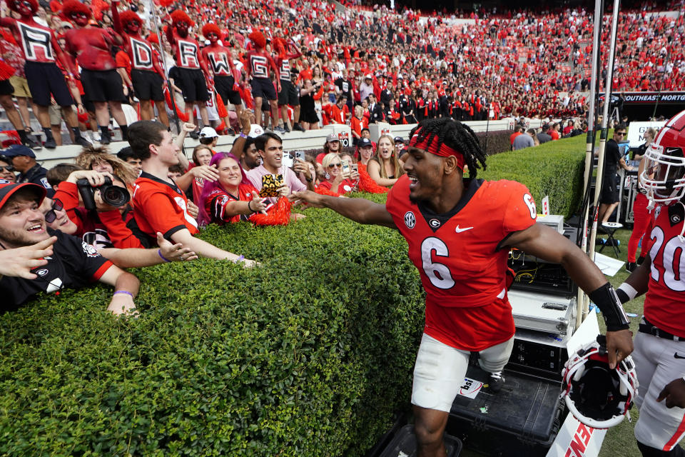 Georgia running back Kenny McIntosh (6) celebrates with the fans after defeating Arkansas in an NCAA college football game Saturday, Oct. 2, 2021, in Athens, Ga.. (AP Photo/John Bazemore)