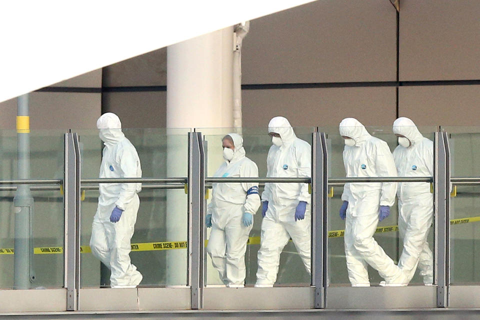 <p>Police forensic officers leave the Manchester Arena as they investigate the scene of an explosion on May 23, 2017 in Manchester, England. (Dave Thompson/Getty Images) </p>