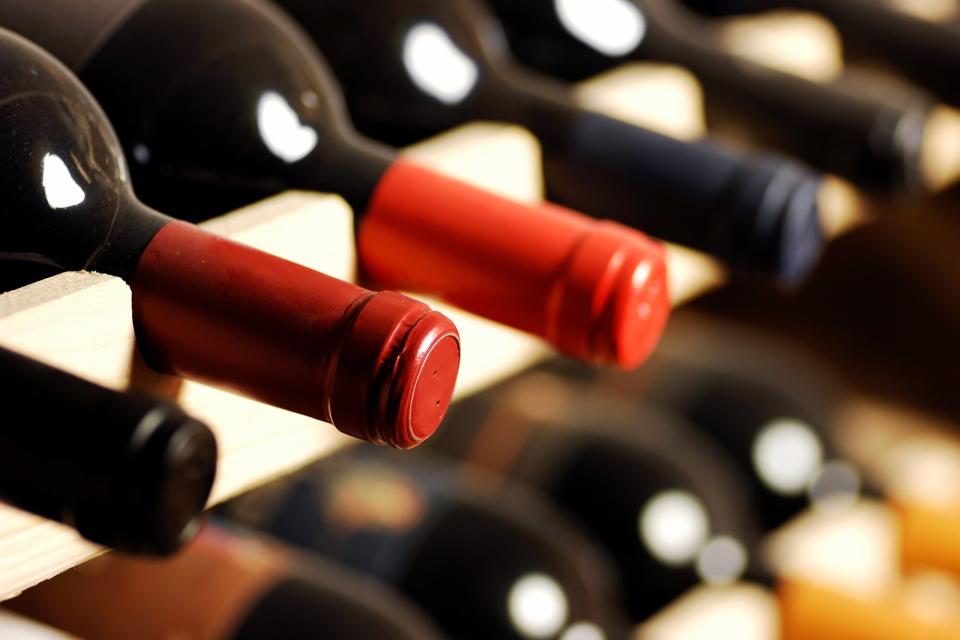 Fine bottles of wine on a cellar rack