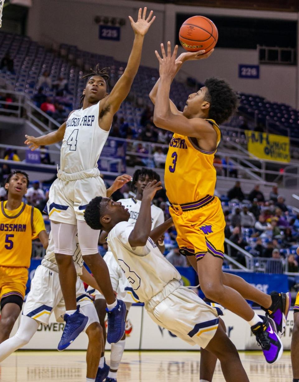 Krystian Lewis goes up against Madison Prep defenders in the 57-38 loss to the chargers in the LHSAA Class 3A championship.