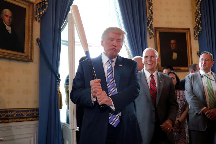 <p>President Trump holds a baseball bat as he participates in a “Made in America” product showcase at the White House in Washington, D.C., July 17, 2017. (Carlos Barria/Reuters) </p>