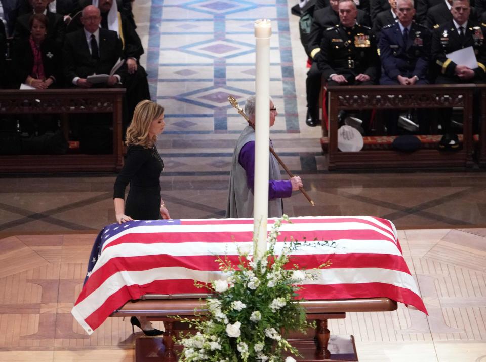 Jenna Bush Hager touches the flag-draped casket of her grandfather, former President George H.W. Bush during his state funeral on Dec. 5, 2018.