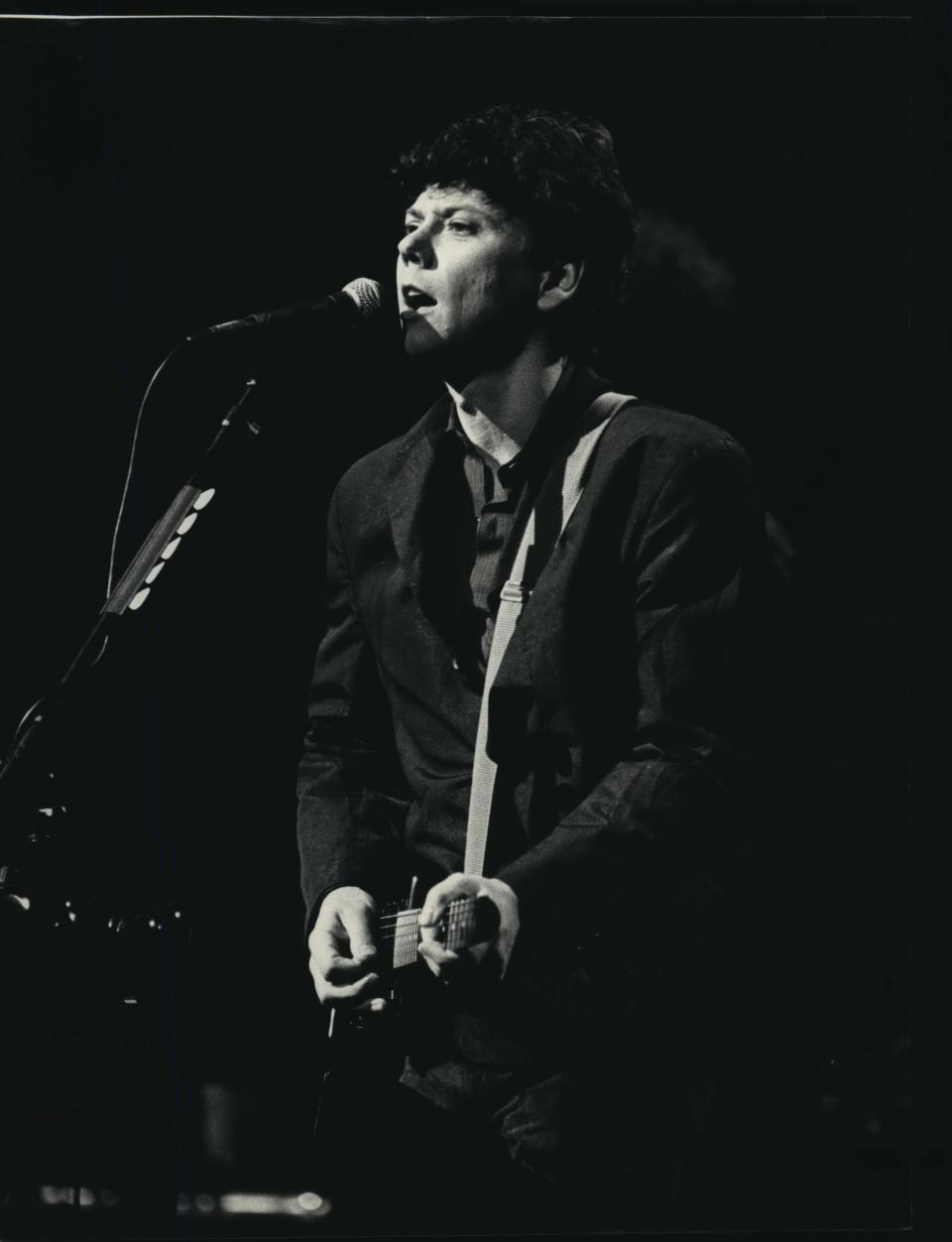 Shorewood native Jerry Harrison, a member of the rock group Talking Heads, played the guitar as he performed in Milwaukee in 1988.