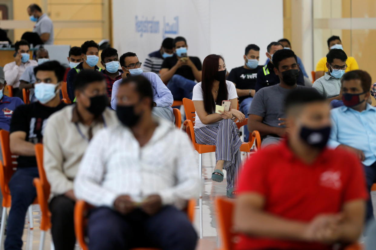 People wait in Sitra Mall to get vaccination against the coronavirus disease (COVID-19), in Sitra, Bahrain, March 23, 2021. Picture taken March 23, 2021. REUTERS/Hamad I Mohammed