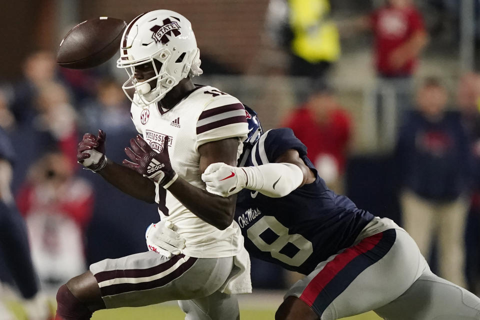 Mississippi linebacker Troy Brown (8) breaks up a pass intended for Mississippi State wide receiver Jaden Walley (11) during the first half of an NCAA college football game in Oxford, Miss., Thursday, Nov. 24, 2022. (AP Photo/Rogelio V. Solis)