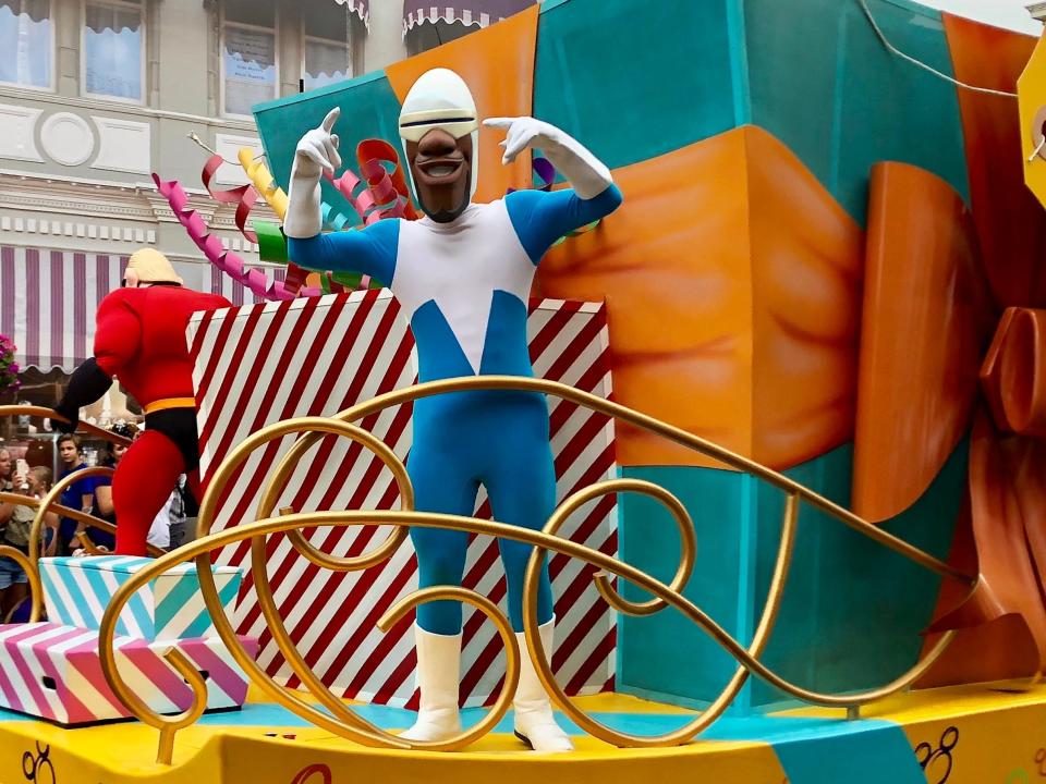 frozone on a float in a parade at disney world