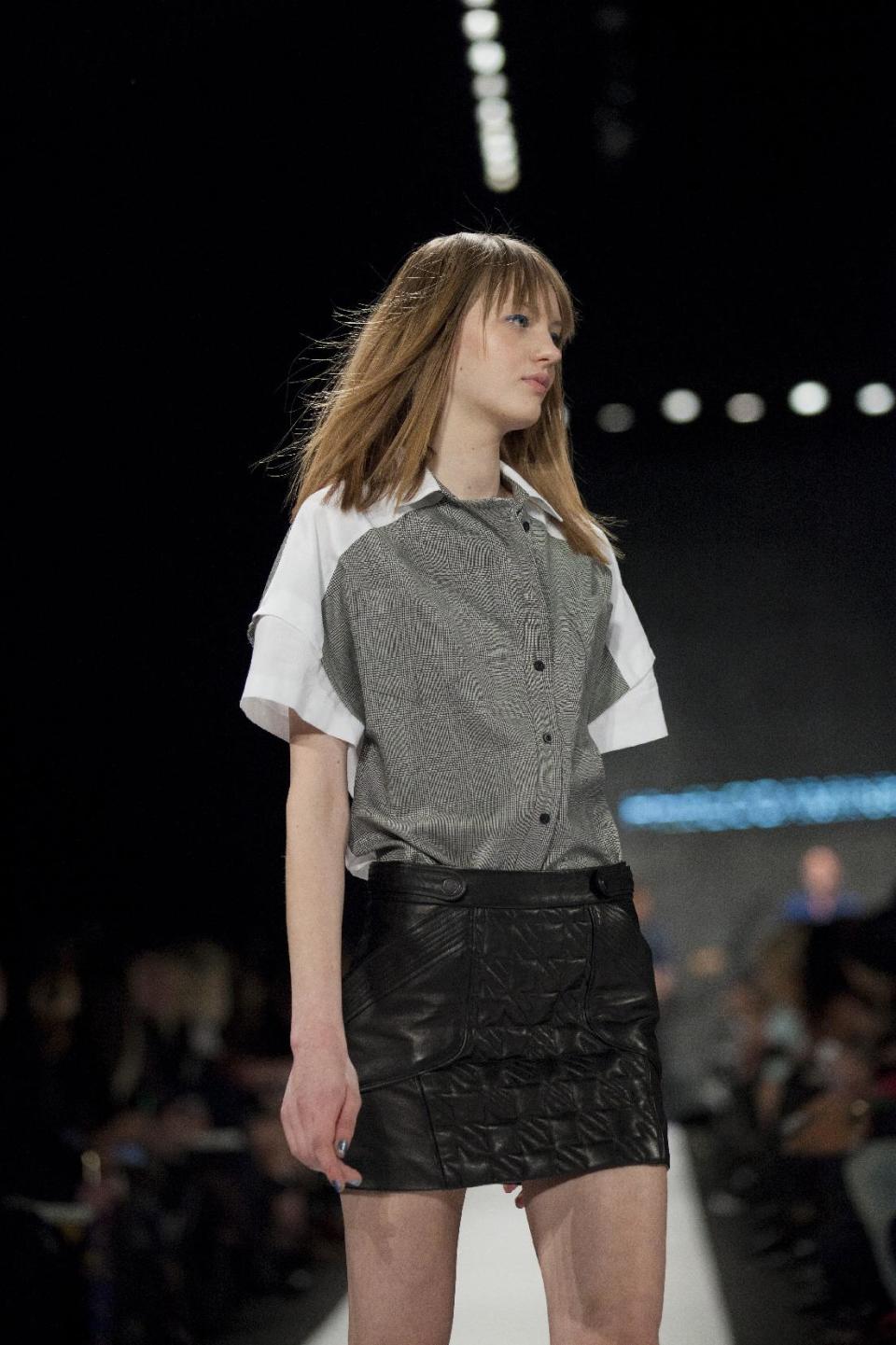 A model walks the runway during the Rebecca Minkoff Fall 2013 fashion show during Fashion Week, Friday, Feb. 8, 2013, in New York. (AP Photo/Karly Domb Sadof)