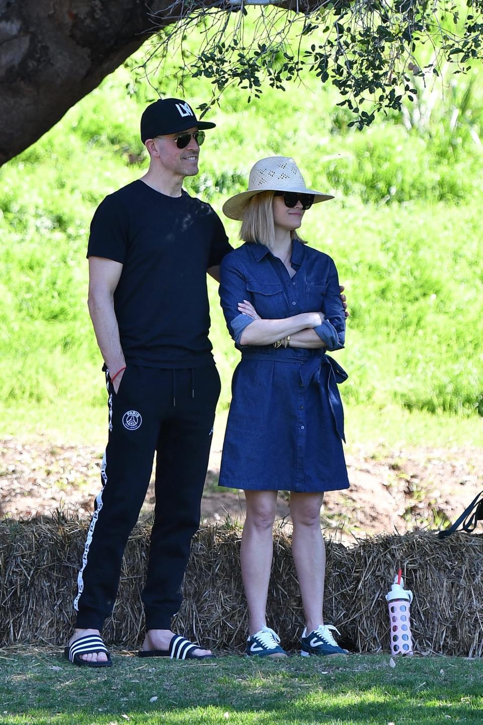 Reese Witherspoon and Jim Toth take their son to a soccer practice.